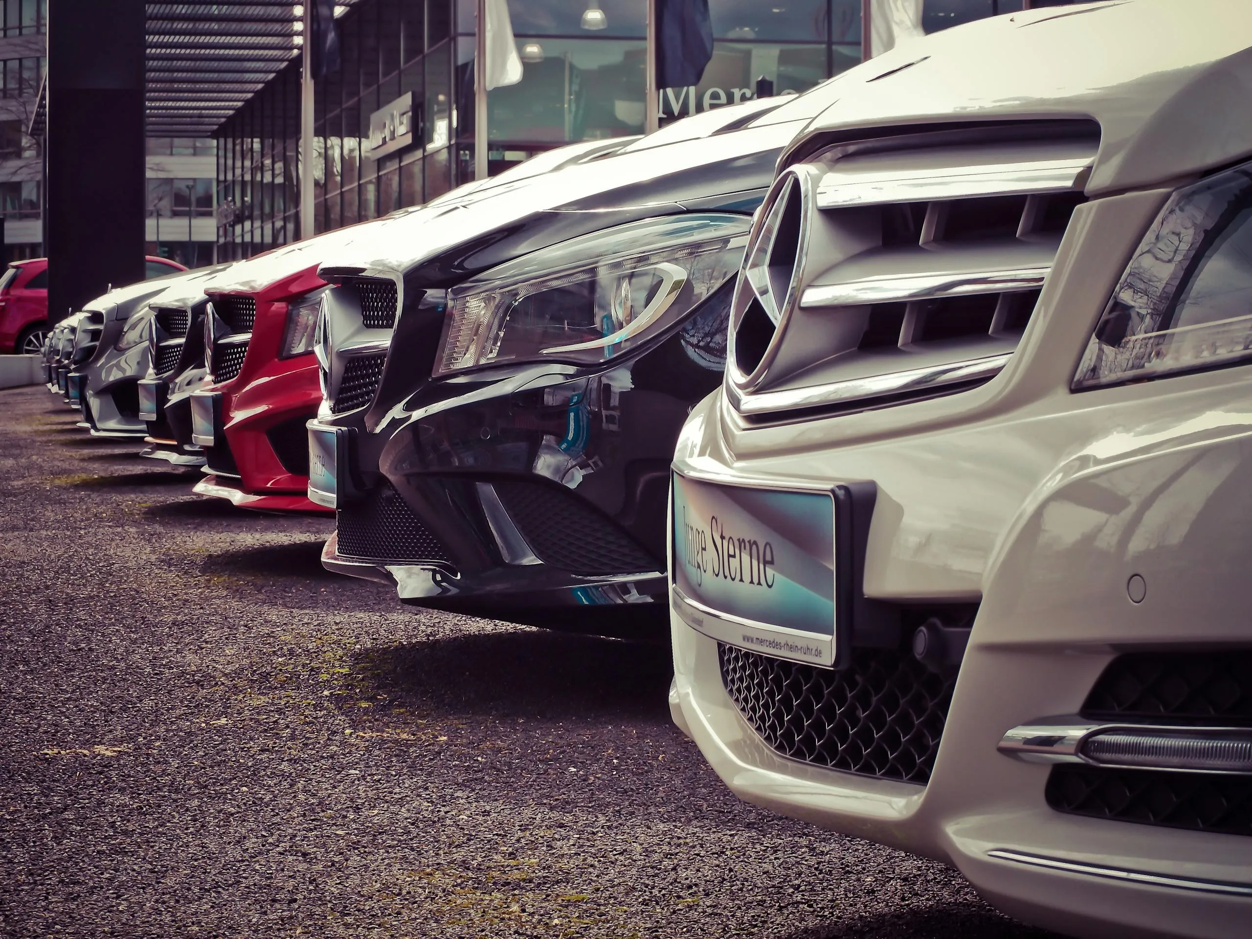 Business fleet vehicles parked in a row